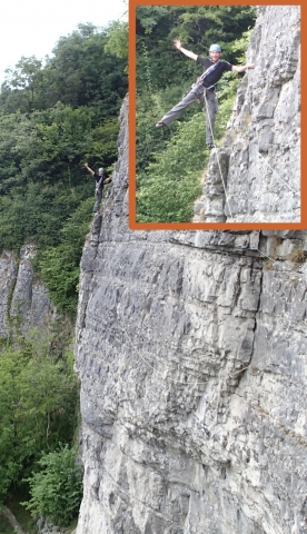 Simon Perry casually posing on a steep cliff